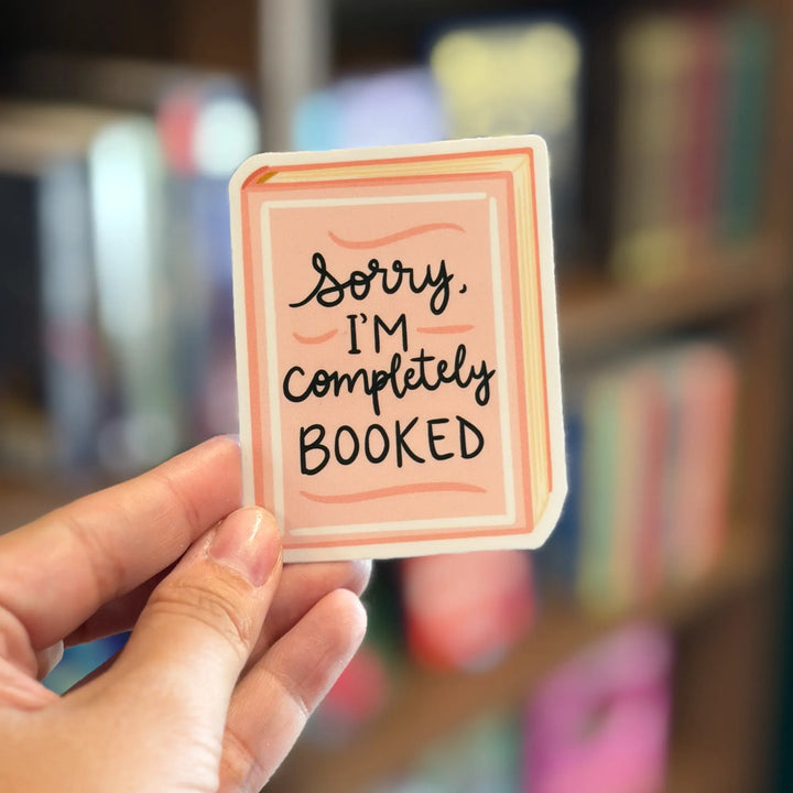 Hand holding a card with &
