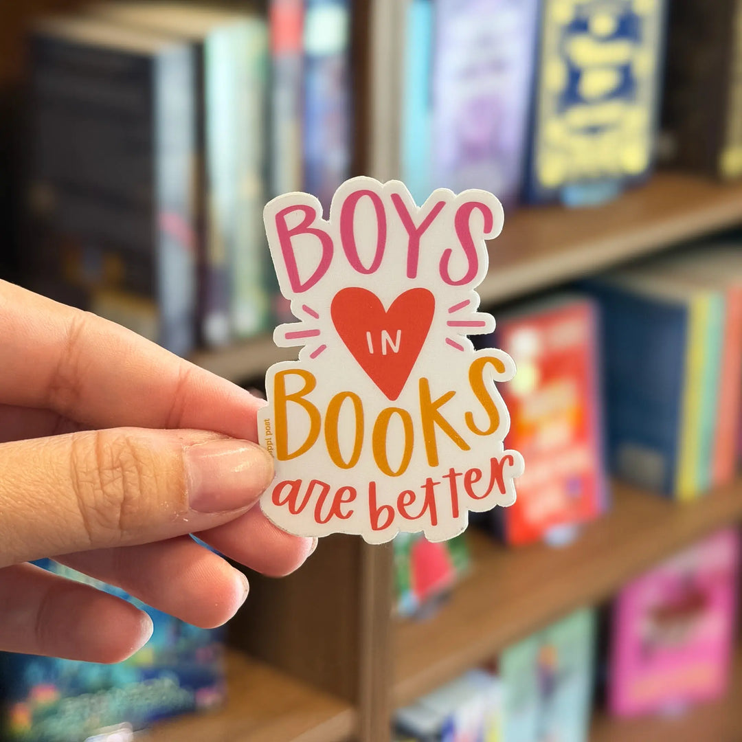 Hand holding a sticker with &