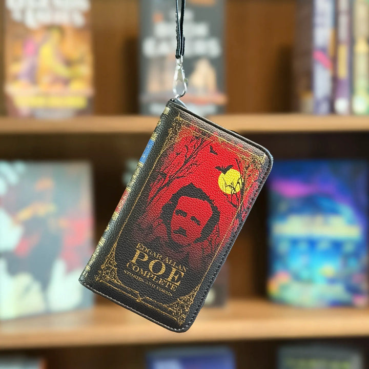 Book-shaped wallet with a literary design on a bookshelf background