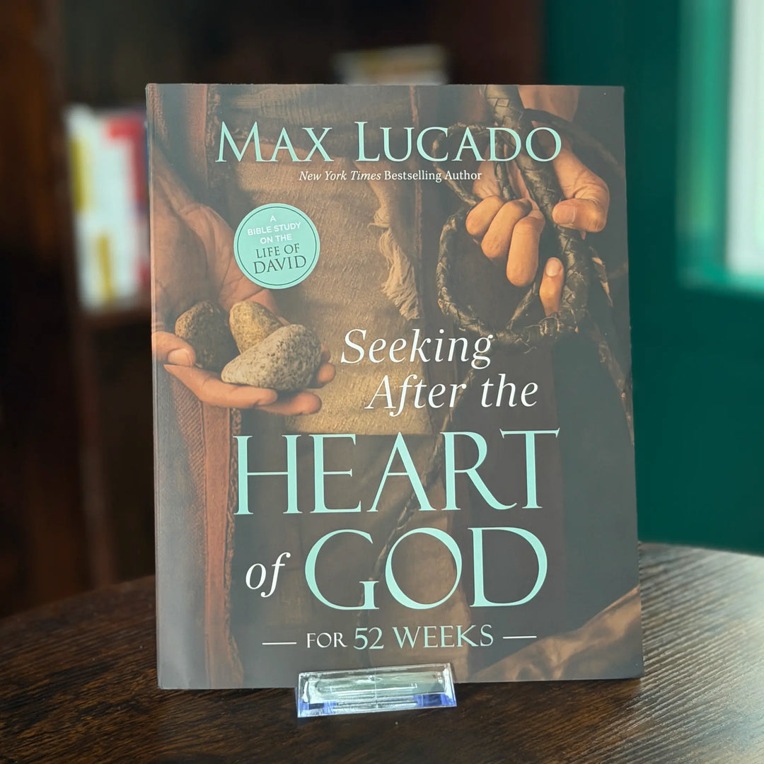Book titled 'Seeking After the Heart of God' by Max Lucado on a wooden surface.