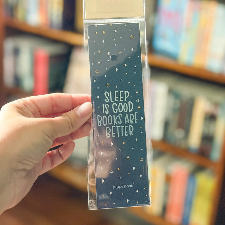 Hand holding a bookmark with &