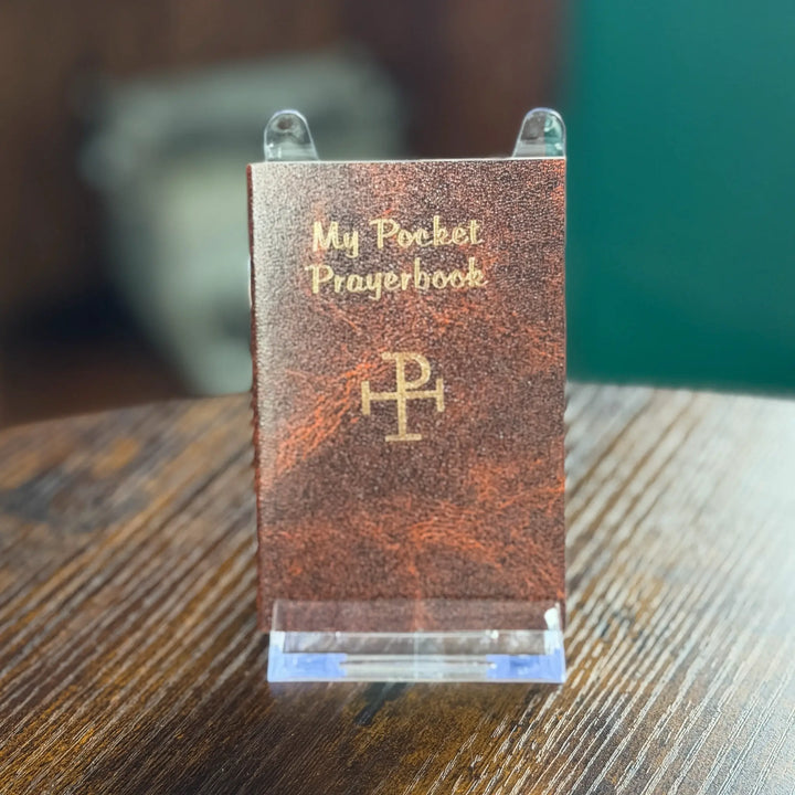 Small leather-bound book titled &