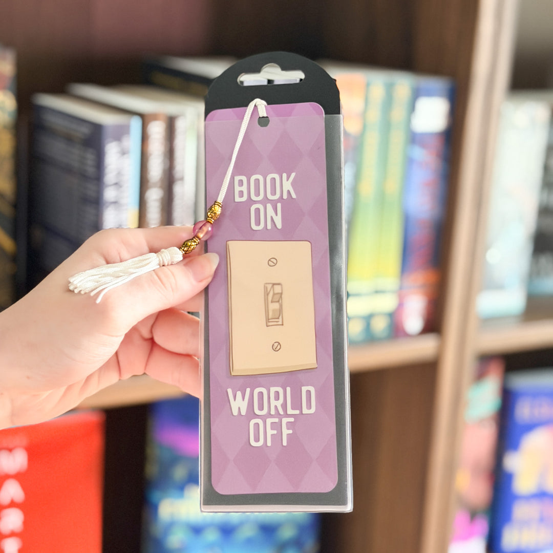 Bookmark with light switch design and text on a purple background