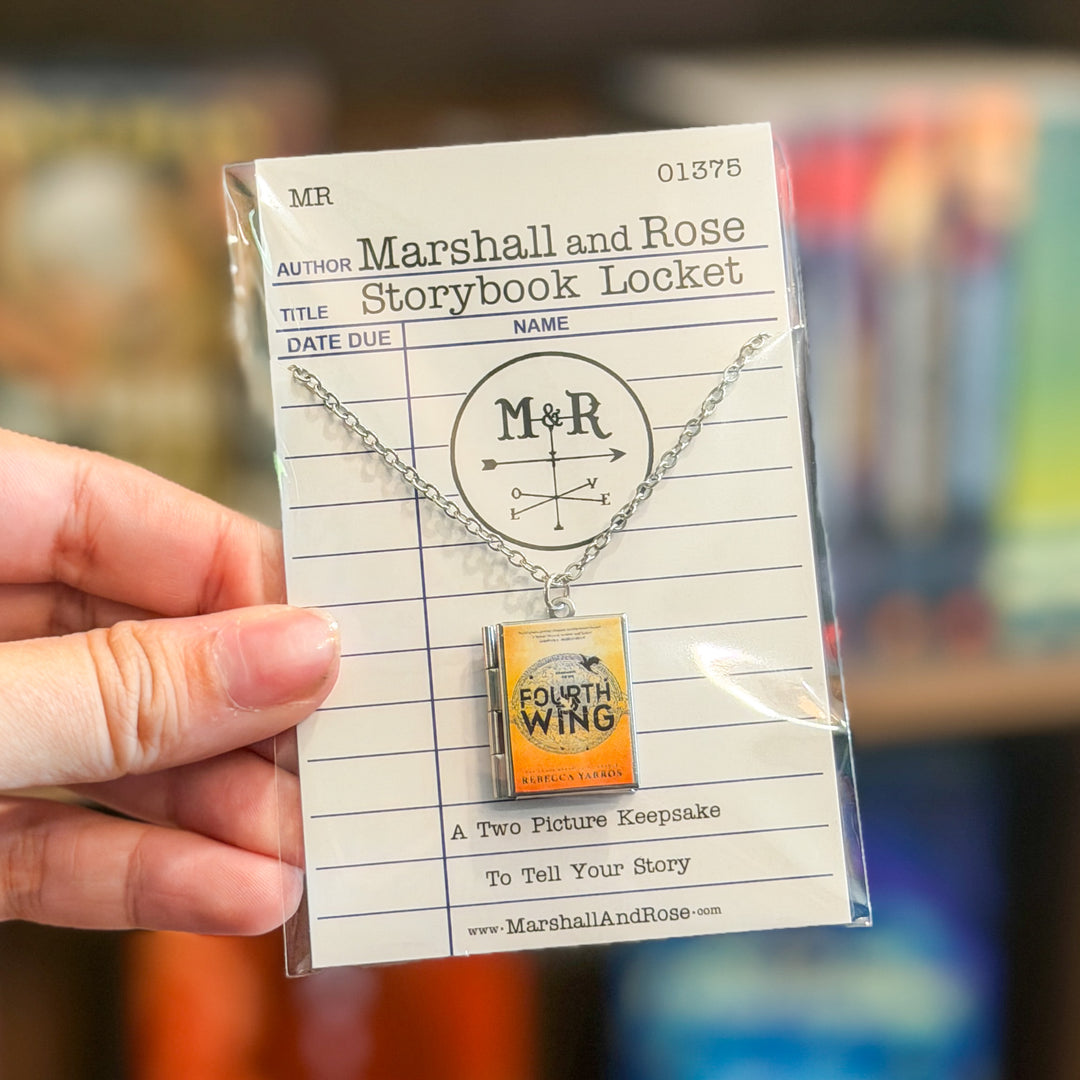 Necklace with book-shaped pendant on a library card-style card with 'M' and 'R' initials.
