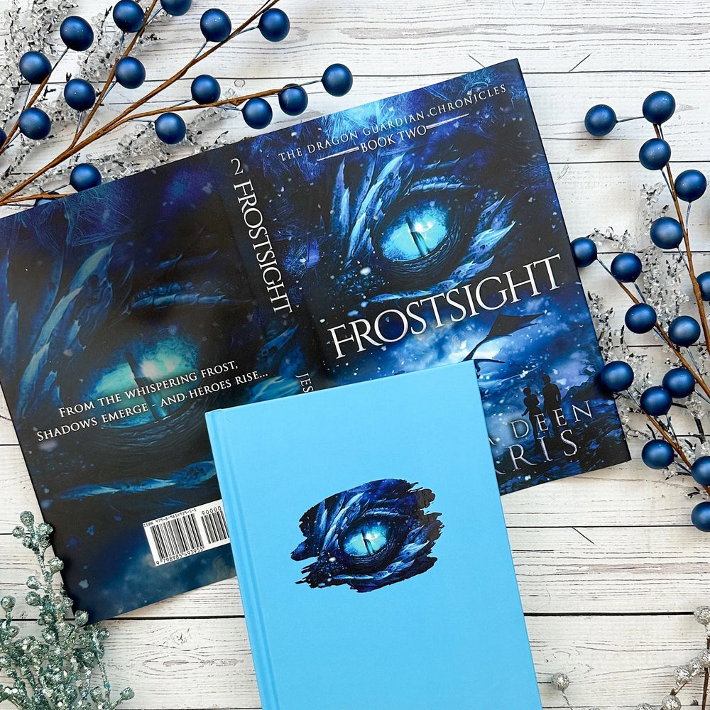 Book titled 'Frostsight' on a wooden surface with decorative elements.