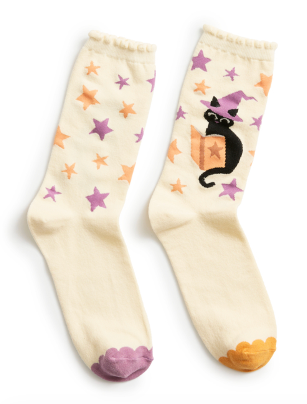 Socks with a cat wearing a witch's hat and reading a book