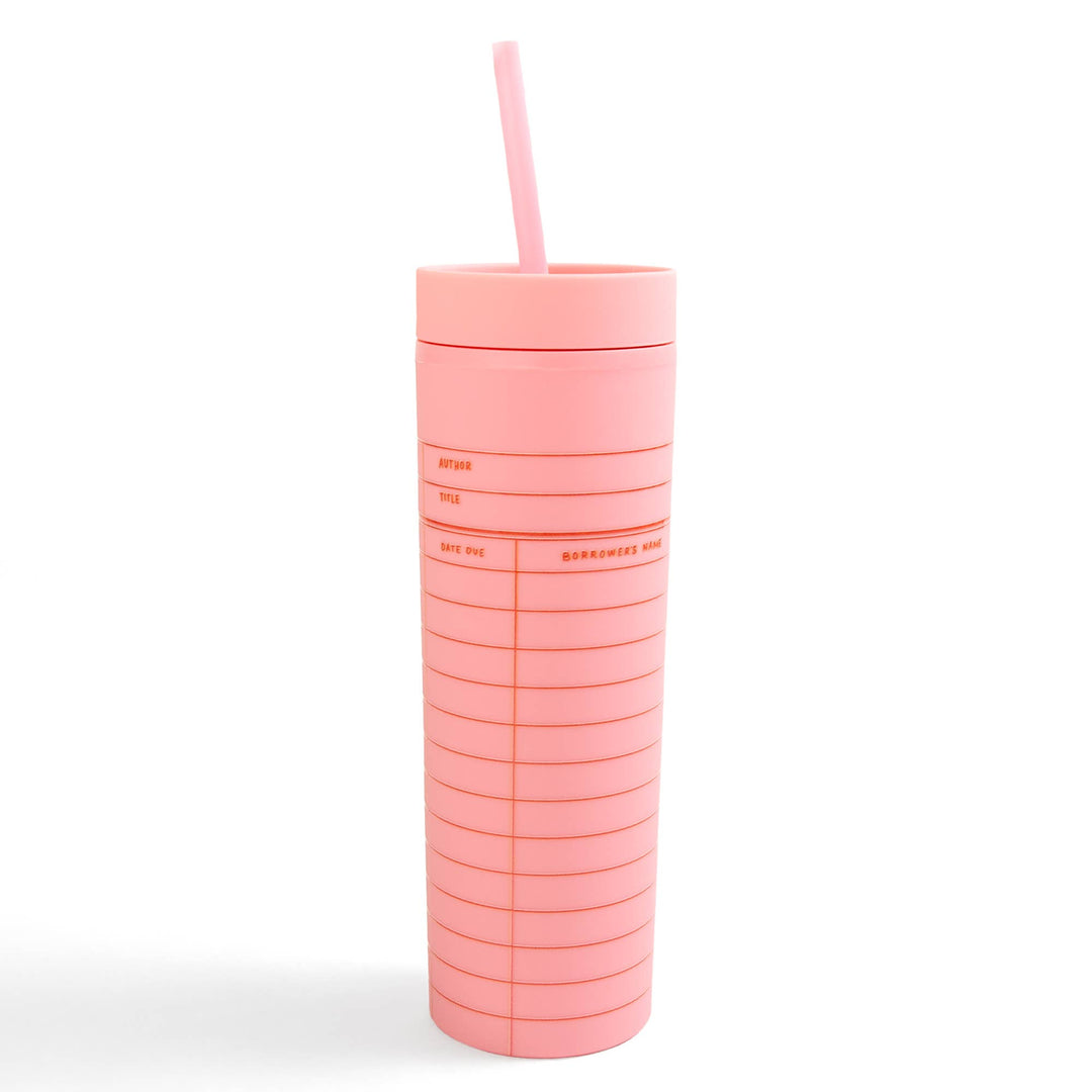 Pink tumbler with a straw on a white background
