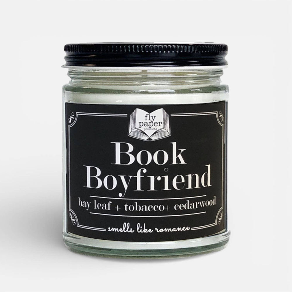 Candle jar labeled 'Book Boyfriend' with a black lid on a white background