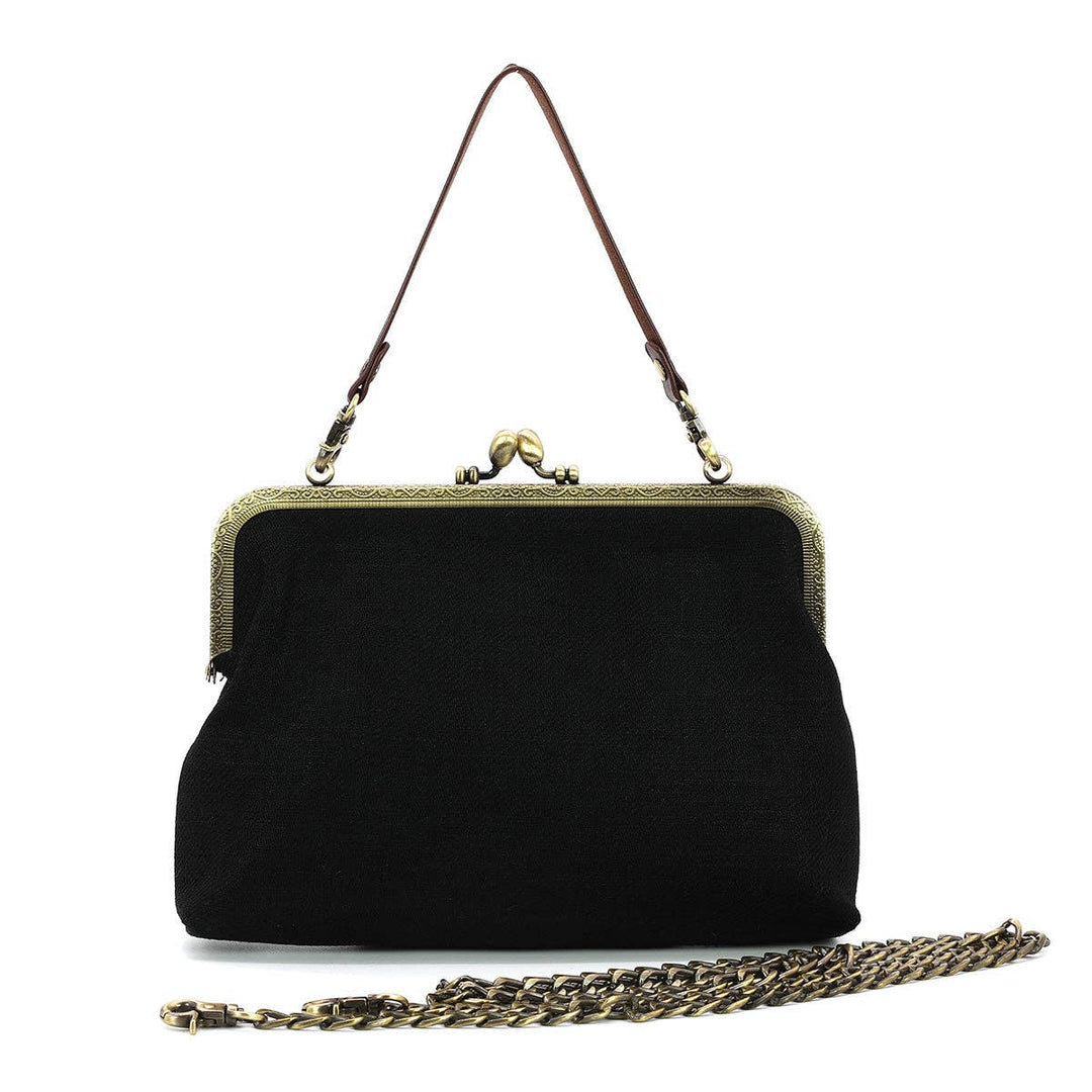 Black handbag with gold chain and frame on a white background