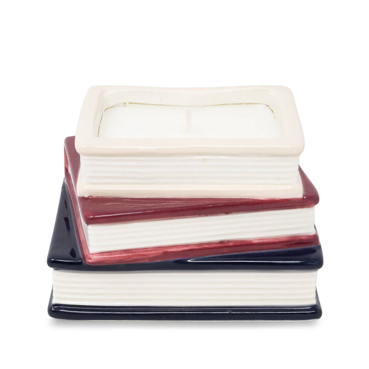 Back view of Jane Austen bookstack candle showing sculpted white page edges and cream, burgundy, and navy covers.