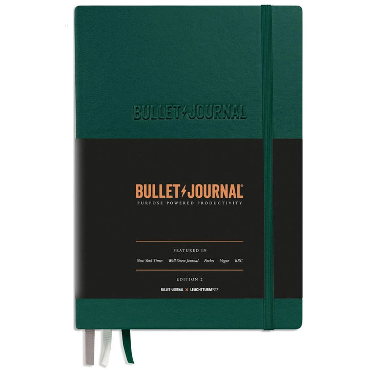 Green notebook with &