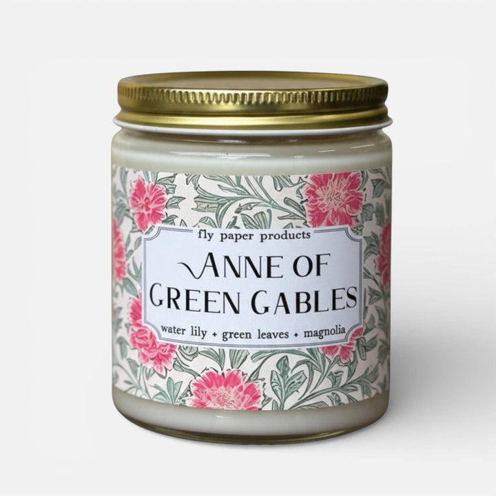 Candle jar with floral label featuring &