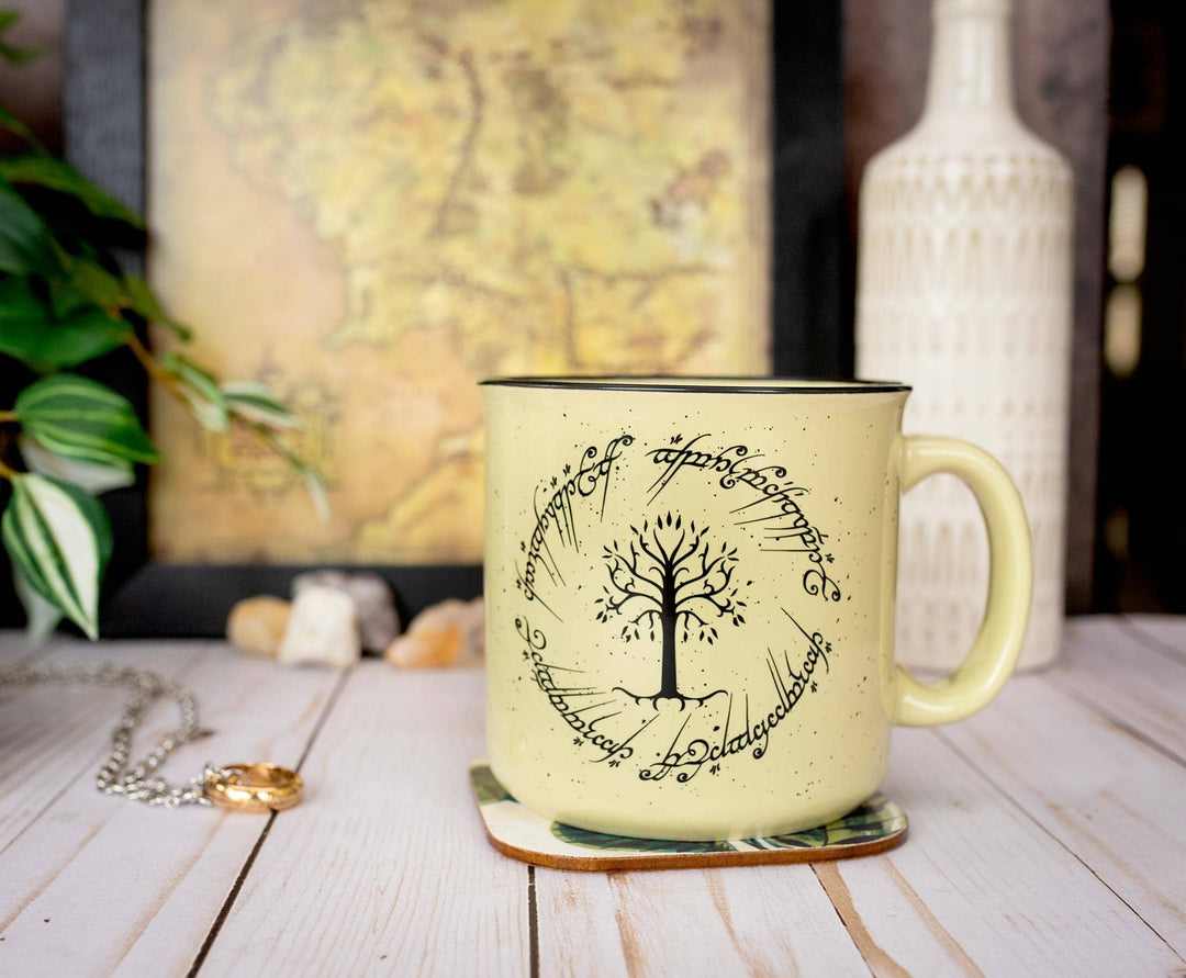 Mug with a tree design and text on a wooden surface with a blurred background