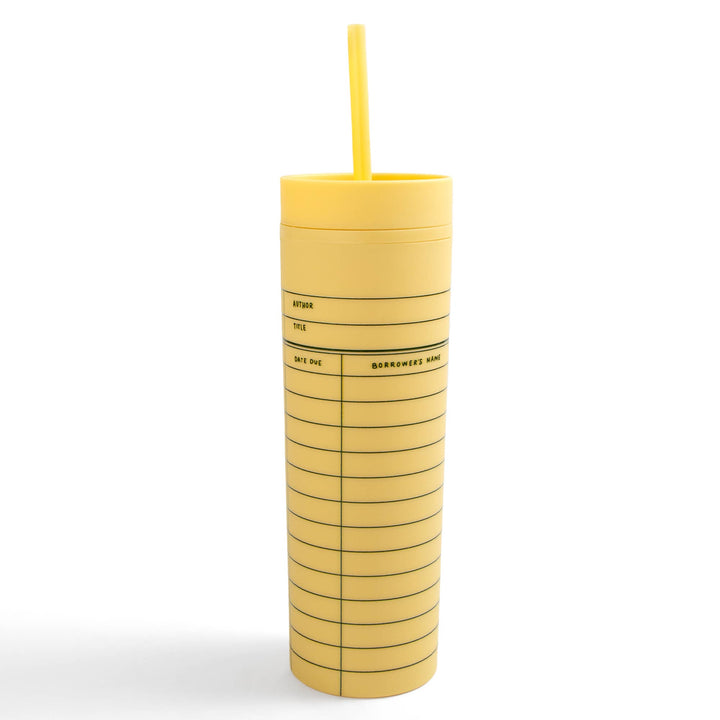 Yellow tumbler with a straw on a white background