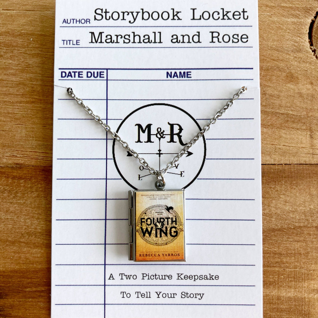 Necklace with book-shaped pendant on a library card-style card with &