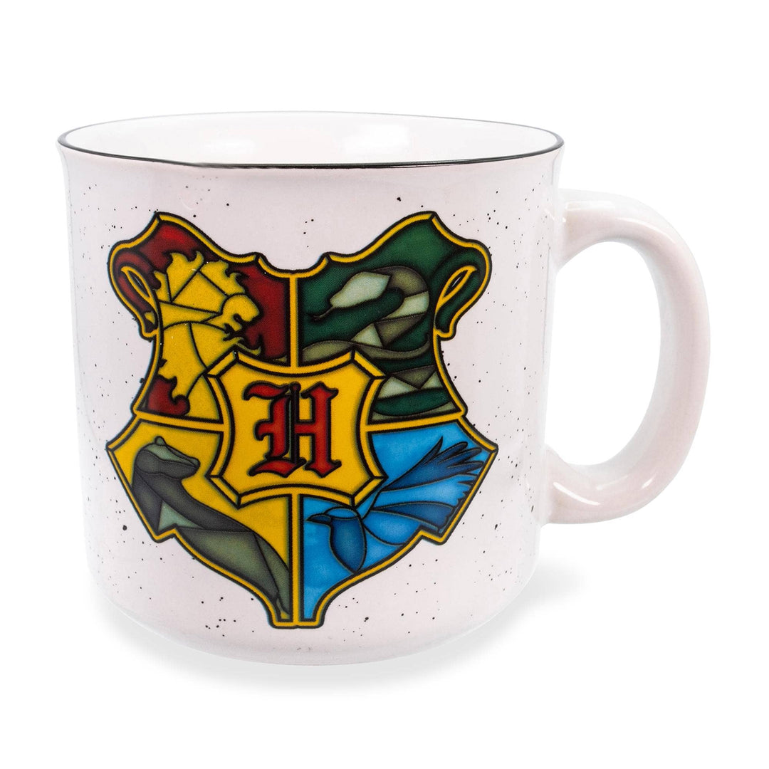 White mug with Hogwarts crest design on a white background