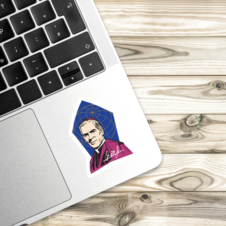 Laptop with a sticker of a person in a purple robe on a wooden surface