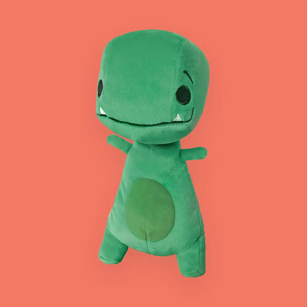 Green plush toy on a solid orange background