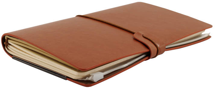 Brown leather notebook with a strap closure on a white background