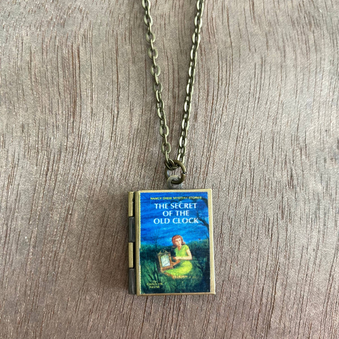 Book-shaped pendant on a chain with &