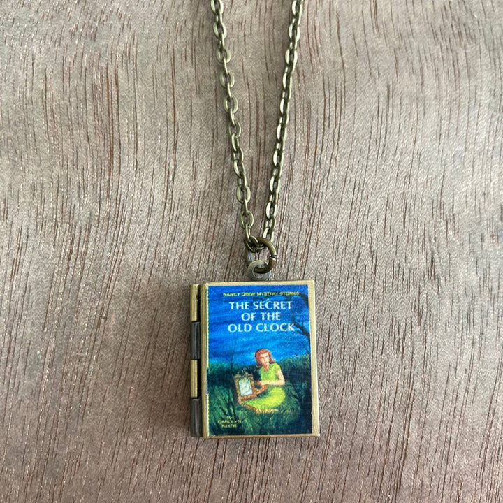 Book-shaped pendant on a chain with &
