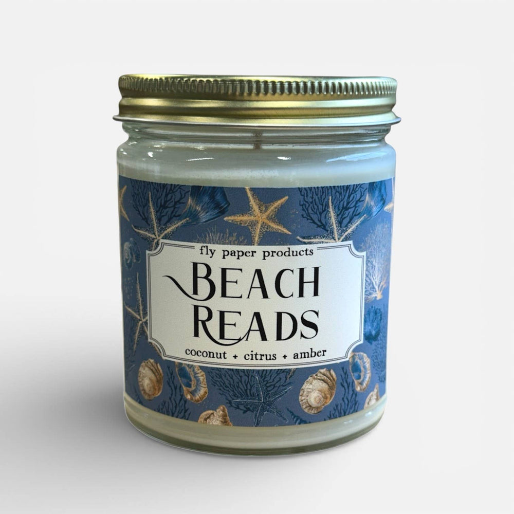 Candle jar labeled 'Beach Reads'