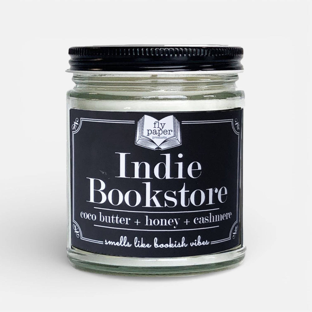 Glass candle jar with black label featuring 'Indie Bookstore' on a white background