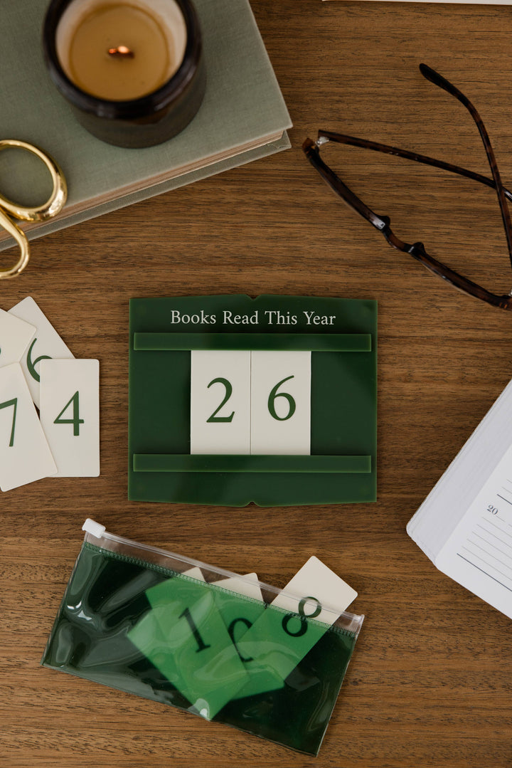 A dark green calendar block displaying &