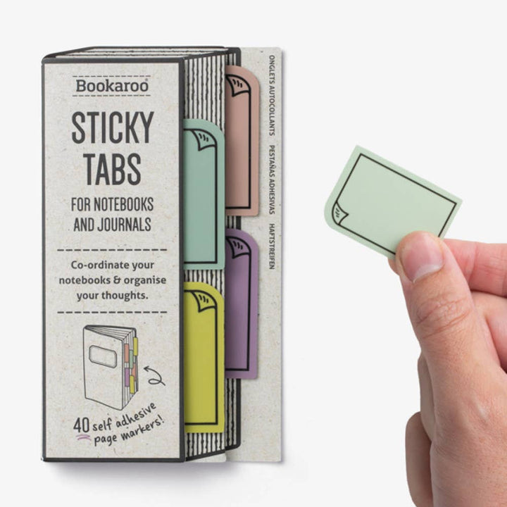 Bookaroo Sticky Tabs packaging with a hand holding a green sticky tab on a white background