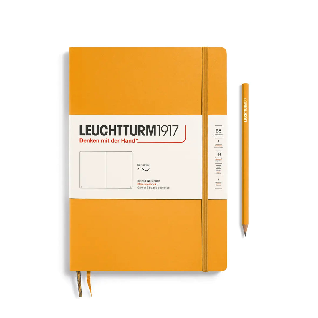 Golden yellow notebook with a pen on a white background, featuring Leuchtturm1917 branding.
