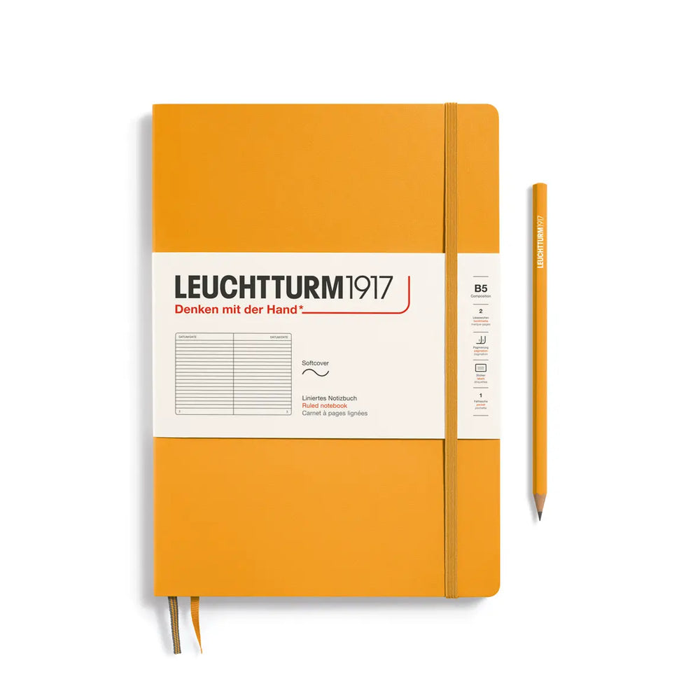 Golden yellow notebook with a pen on a white background, featuring Leuchtturm1917 branding.