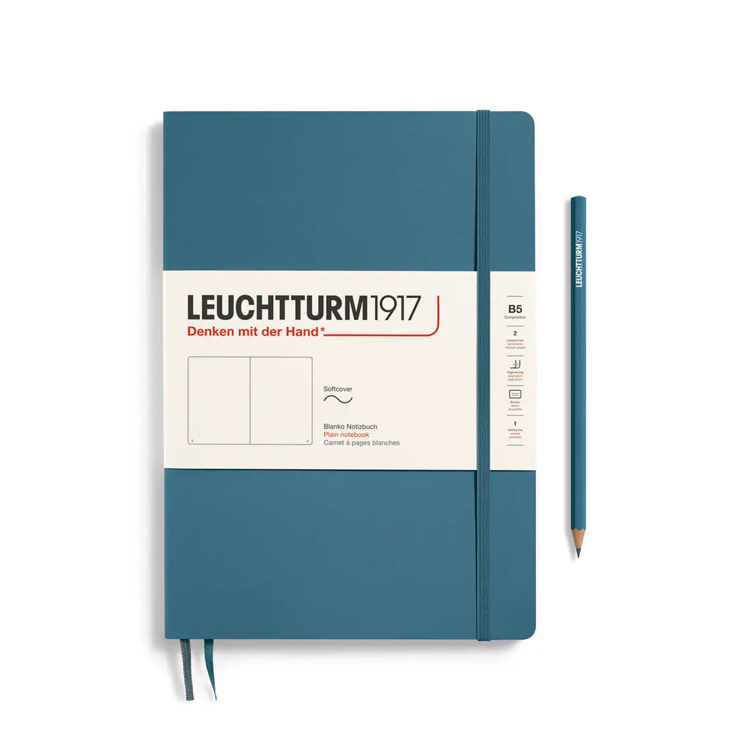 Blue notebook with Leuchtturm1917 branding and a pencil on a white background
