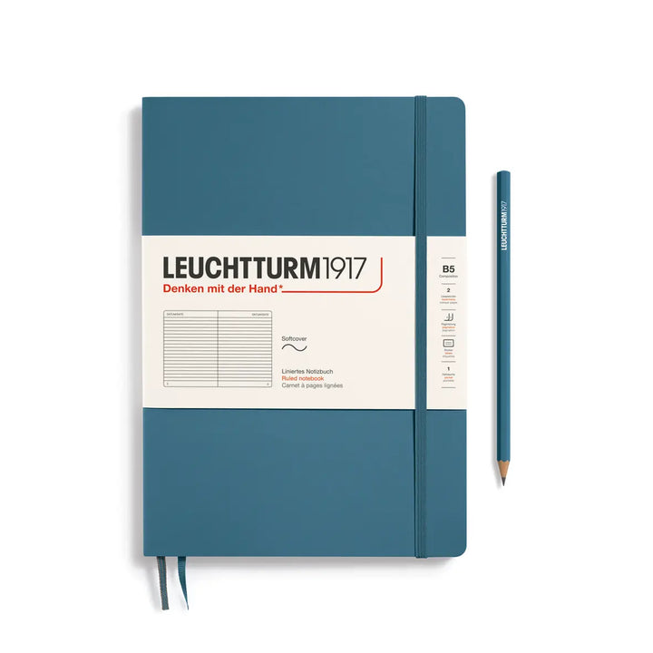 Blue notebook with Leuchtturm1917 branding and a pencil on a white background