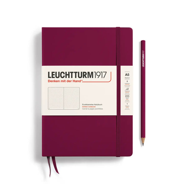 Maroon notebook with a pencil on a white background, featuring Leuchtturm1917 branding.