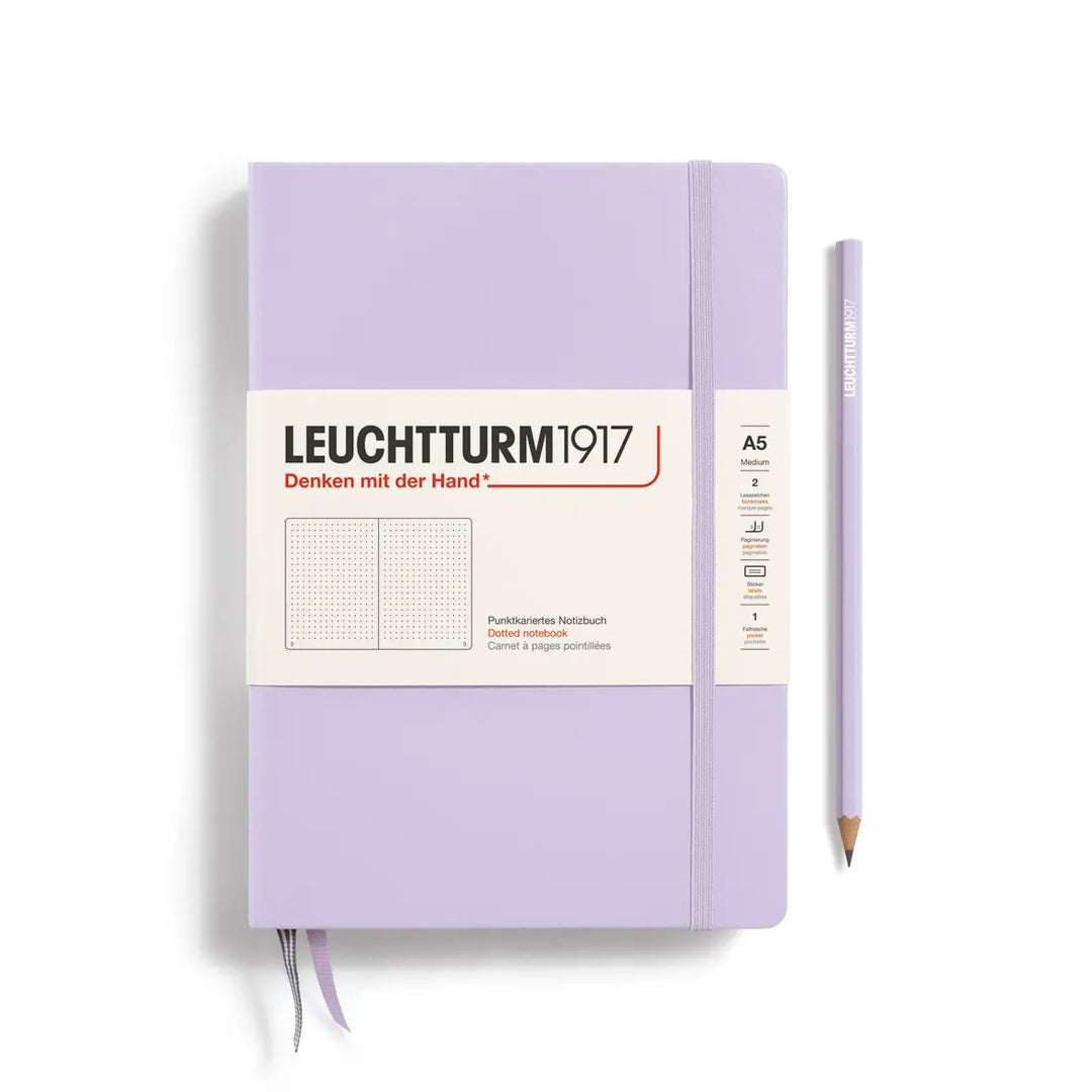 Purple notebook with a pencil on a white background, featuring Leuchtturm1917 branding.