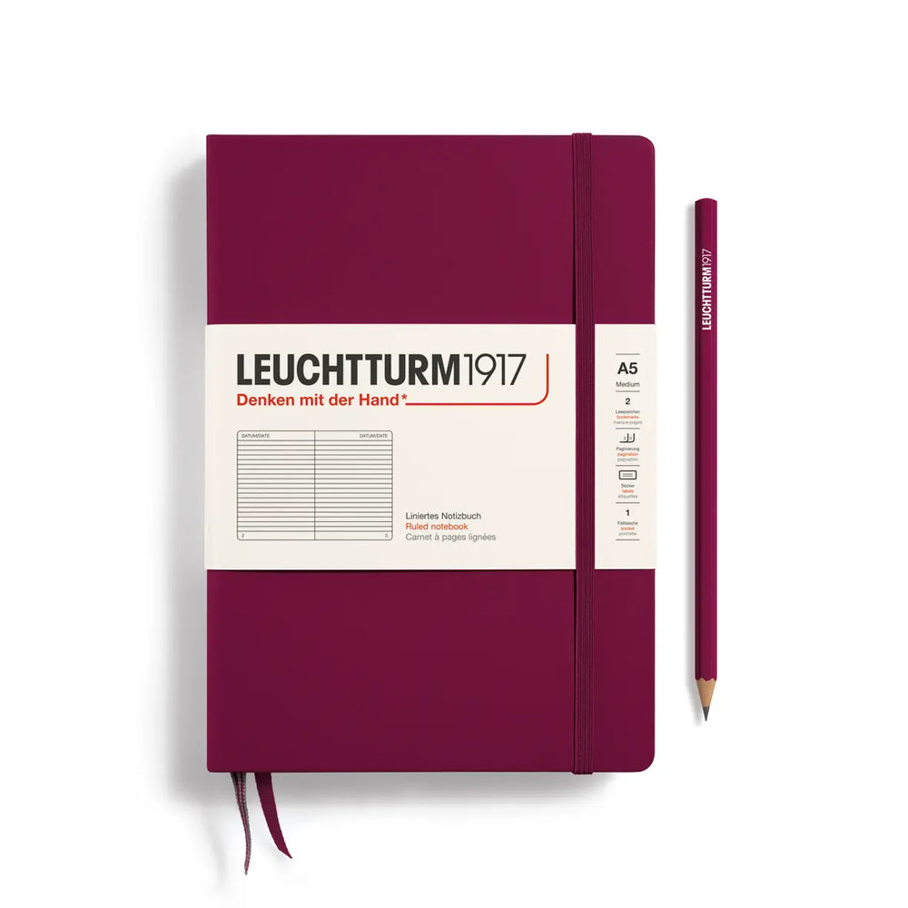 Maroon notebook with pencil on a white background, featuring Leuchtturm1917 branding.