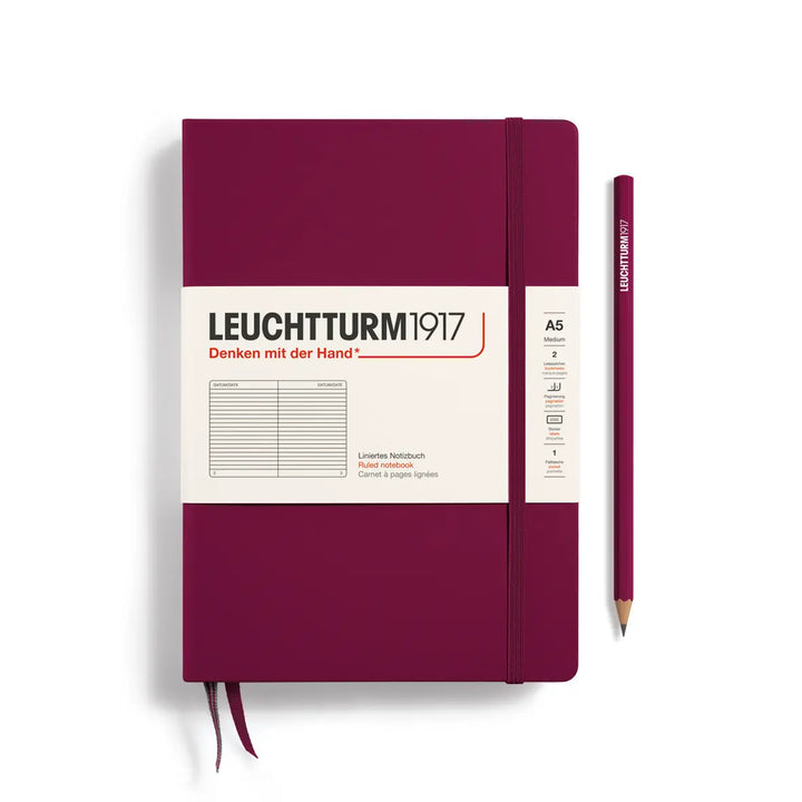 Maroon notebook with pencil on a white background, featuring Leuchtturm1917 branding.