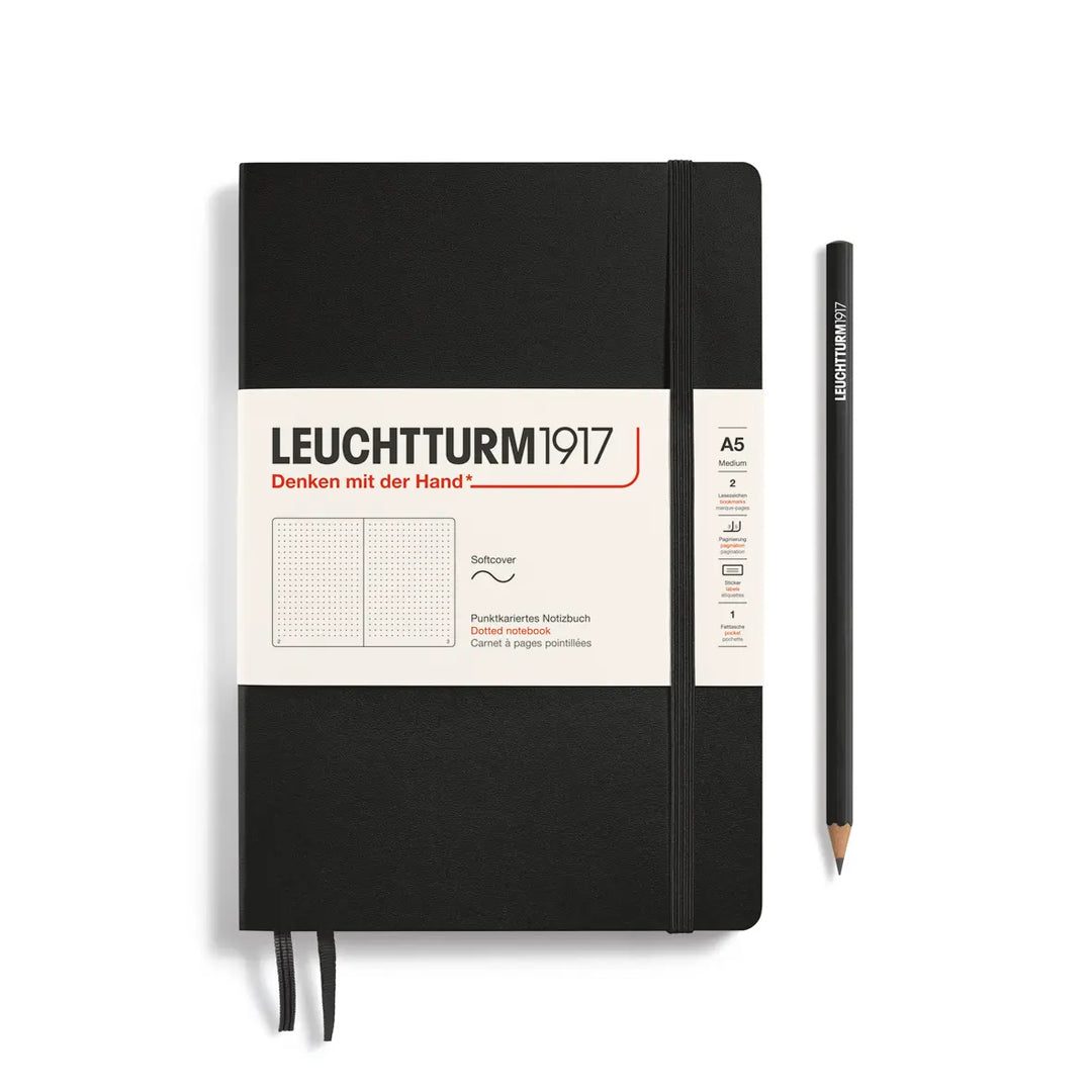 Black notebook with Leuchtturm1917 branding and a pencil on a white background