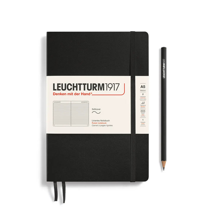 Black notebook with Leuchtturm1917 branding and a pencil on a white background