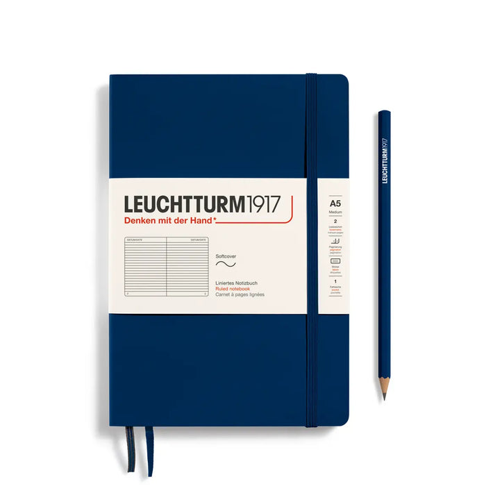 Blue notebook with white label and pencil on a white background, featuring Leuchtturm1917 branding.