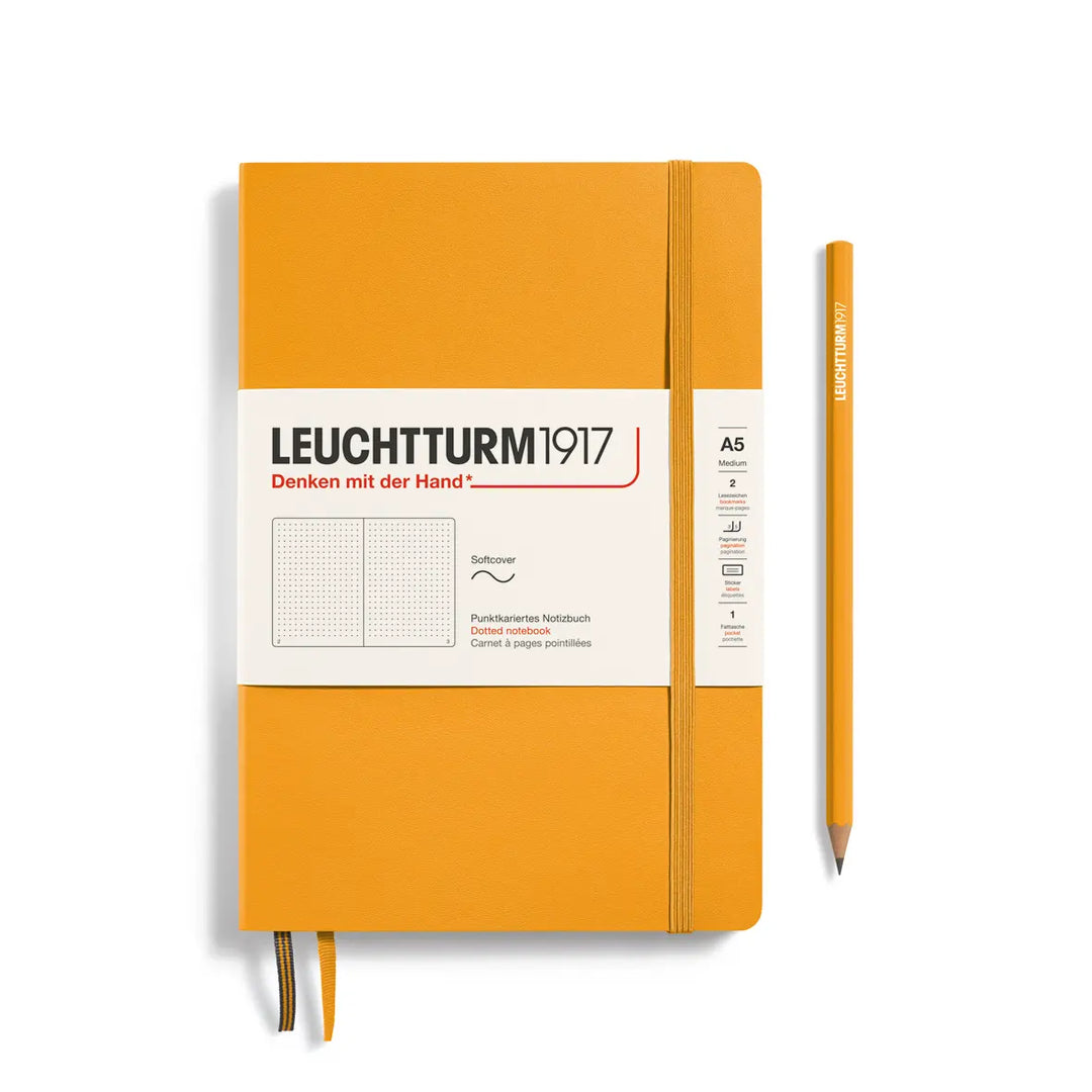 Golden yellow notebook with white label and pencil on a white background, featuring Leuchtturm1917 branding.
