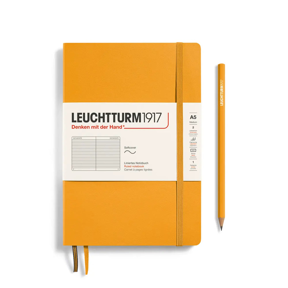 Golden yellow notebook with white label and pencil on a white background, featuring Leuchtturm1917 branding.