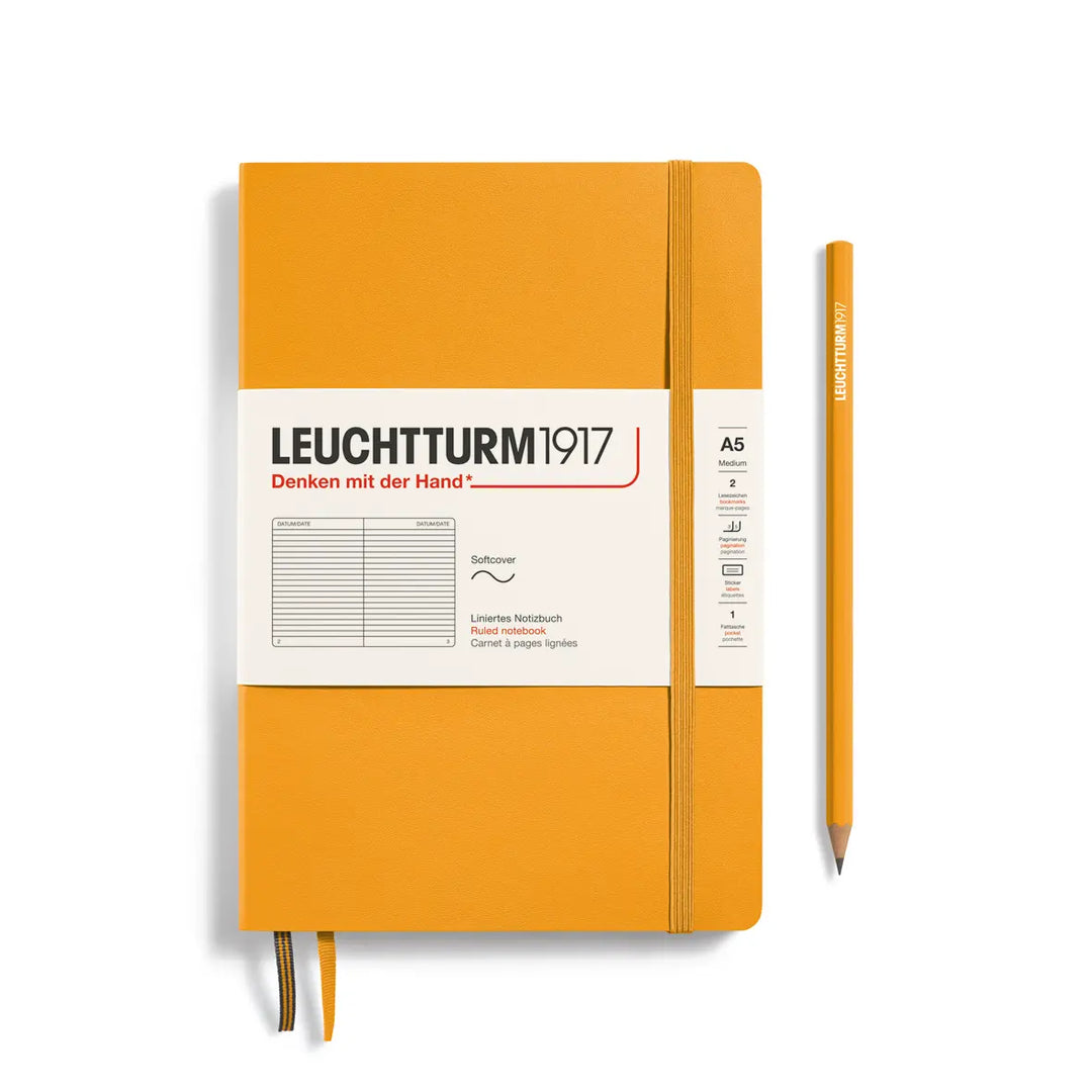 Golden yellow notebook with white label and pencil on a white background, featuring Leuchtturm1917 branding.