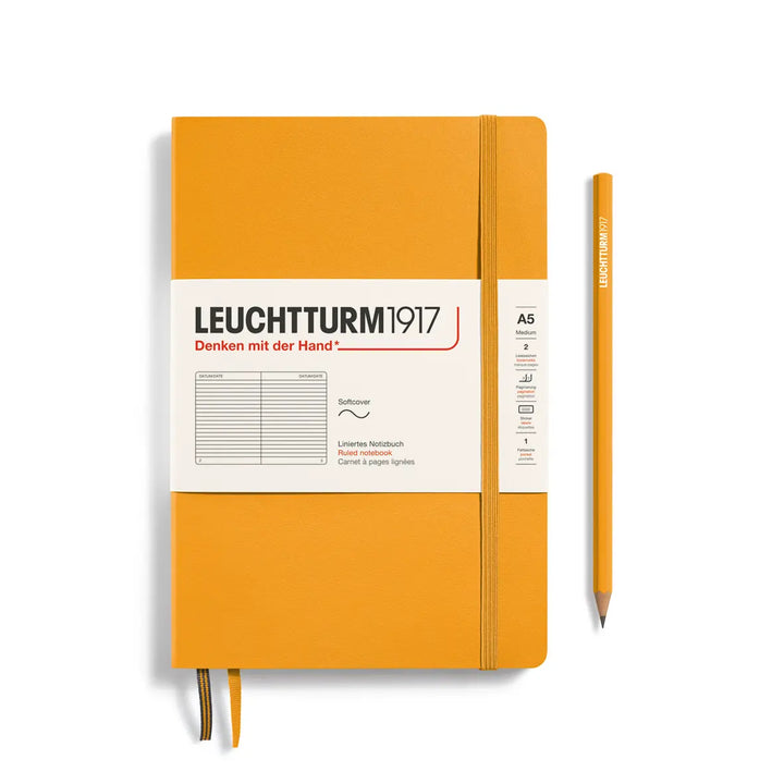 Golden yellow notebook with white label and pencil on a white background, featuring Leuchtturm1917 branding.