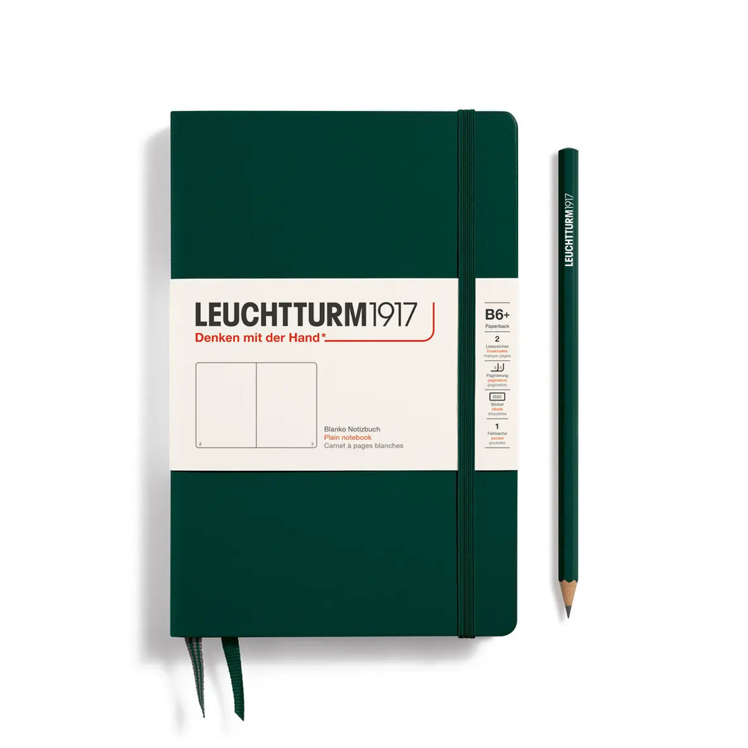 Green notebook with a pencil on a white background, featuring the Leuchtturm1917 brand.