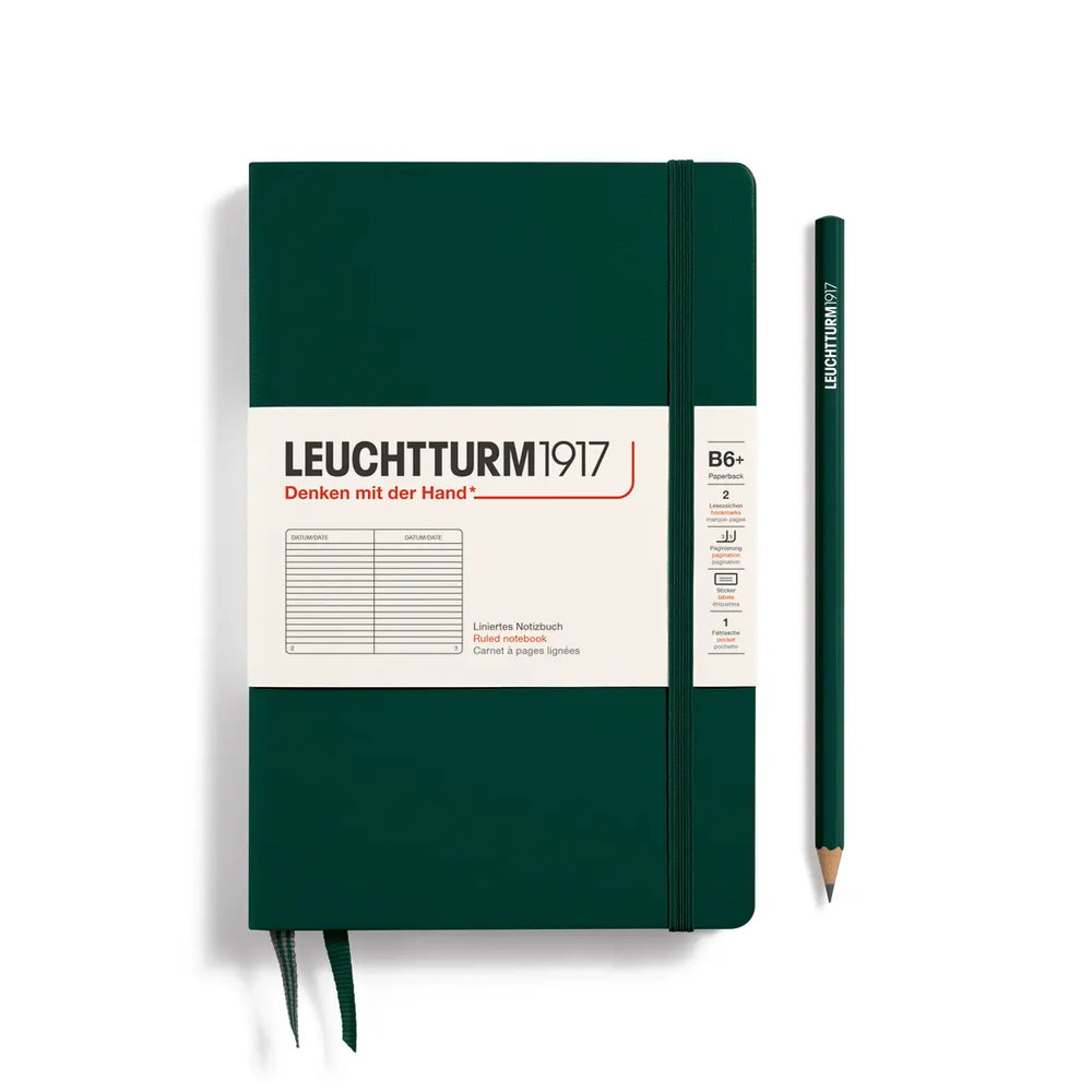Green notebook with white label and pencil on a white background, featuring Leuchtturm1917 branding.