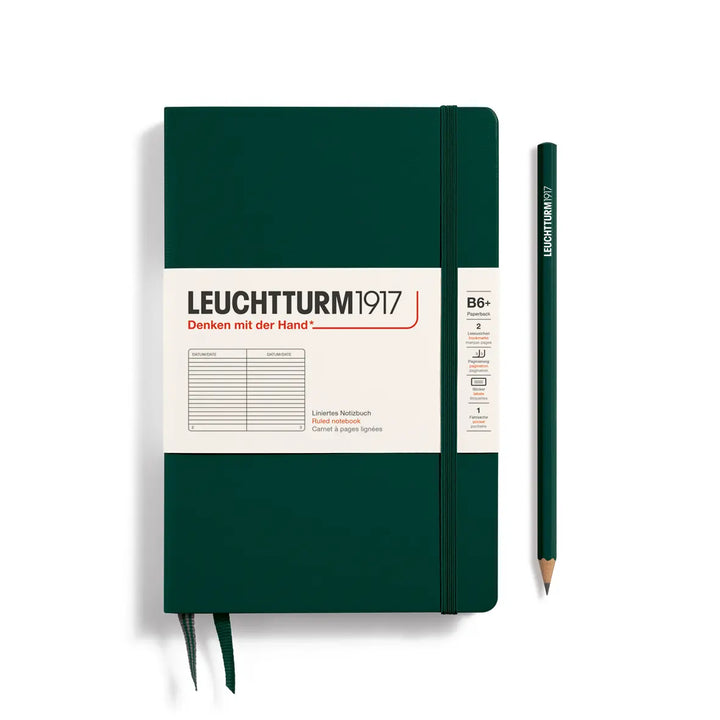 Green notebook with white label and pencil on a white background, featuring Leuchtturm1917 branding.