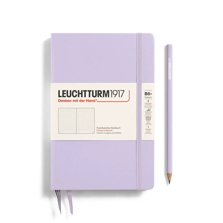 Purple notebook with a pen on a white background, featuring Leuchtturm1917 branding.