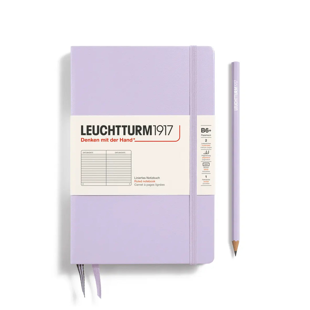 Purple notebook with a pencil on a white background, featuring Leuchtturm1917 branding.