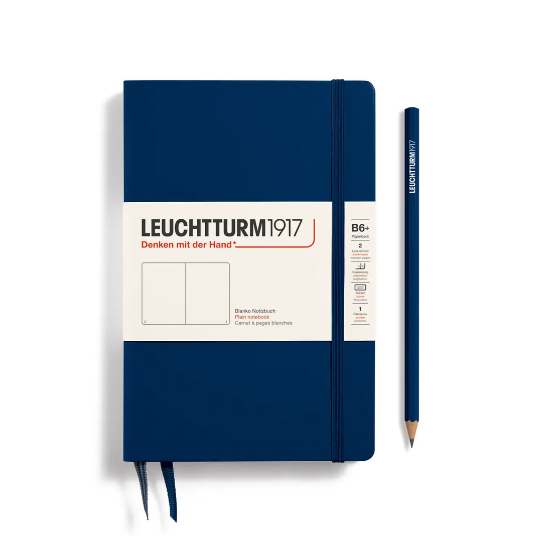 Blue notebook with Leuchtturm1917 branding and a pencil on a white background